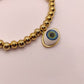 Pulsera balines y ojo realista
